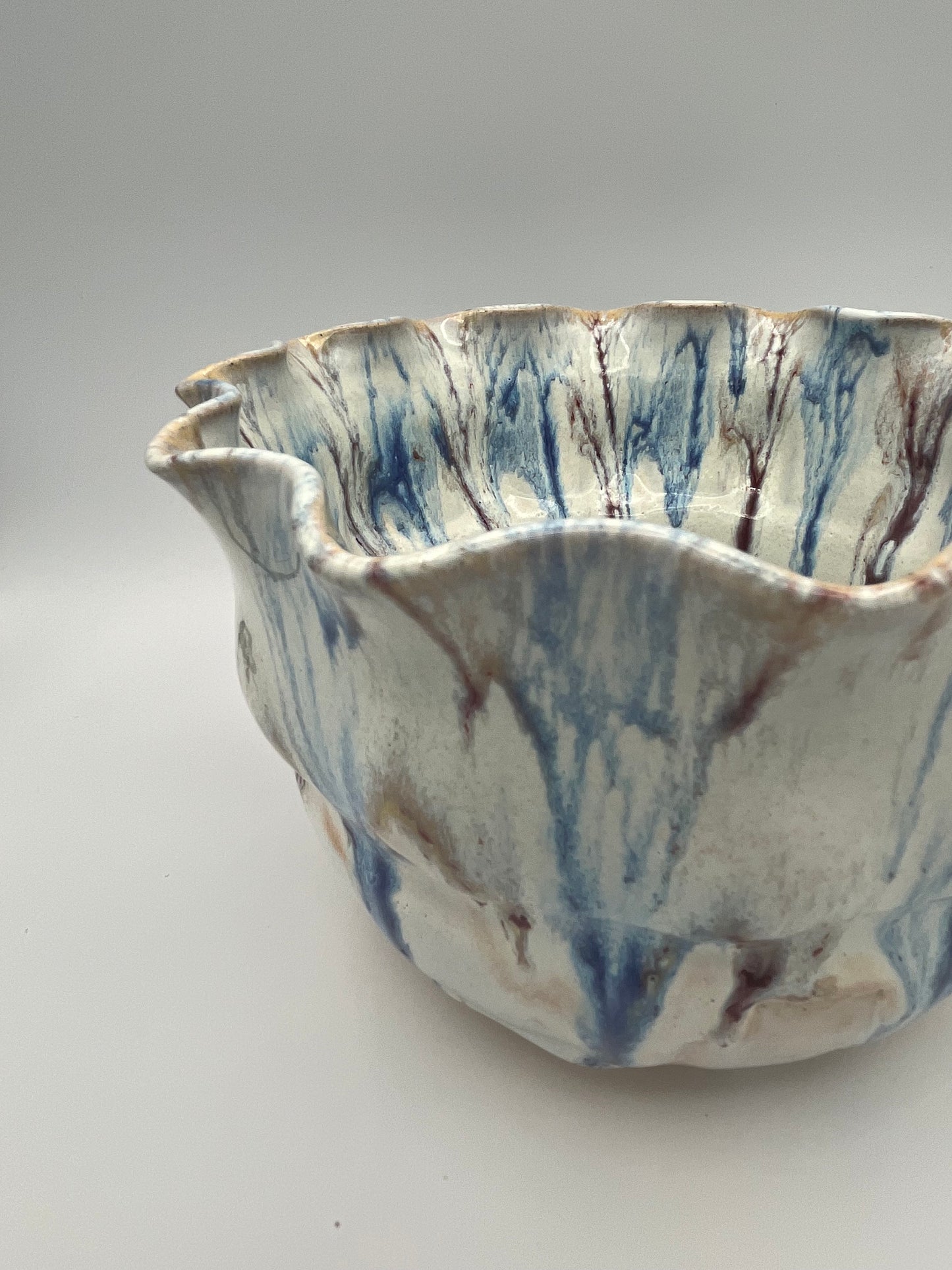 Wheel-thrown mixing bowl with fluted edge