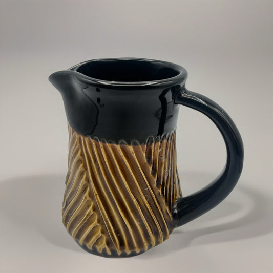 Black and Red Iron Creamer