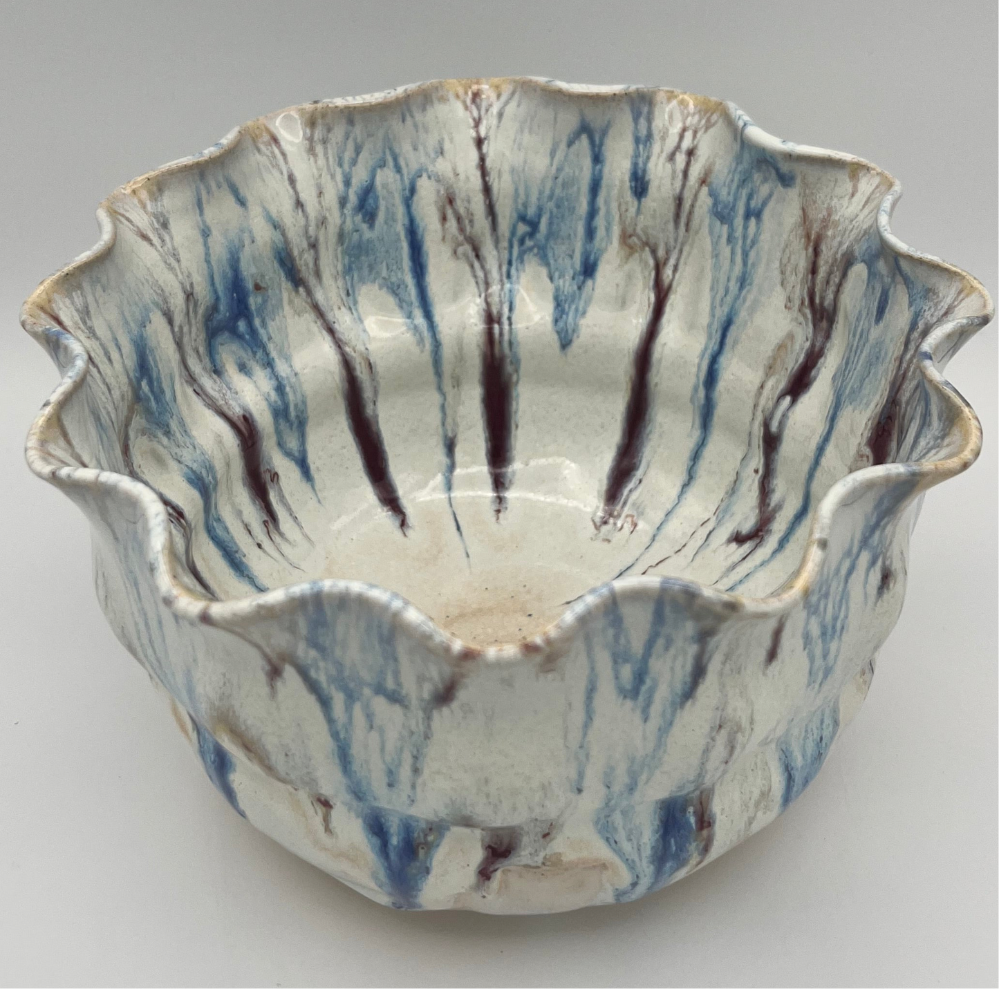Wheel-thrown mixing bowl with fluted edge