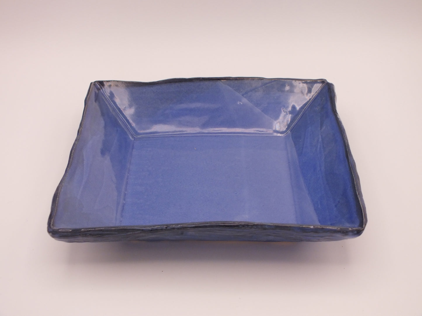 Blue Ceramic square dish on a white background