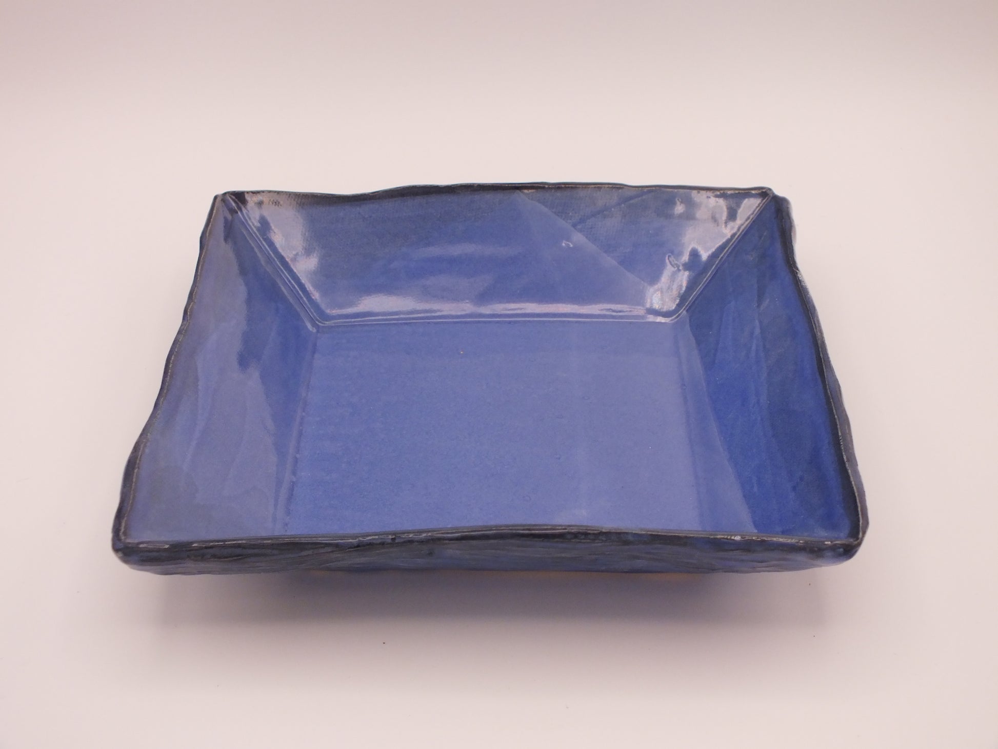 Blue Ceramic square dish on a white background