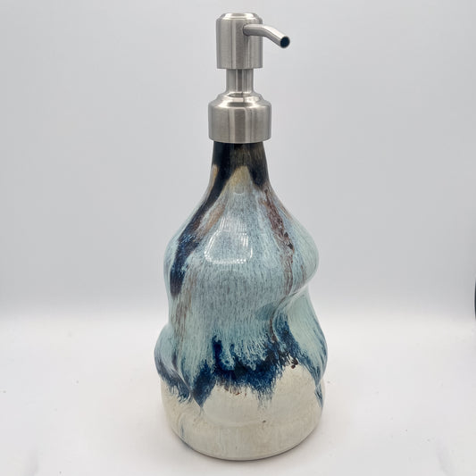 Handmade ceramic soap dispenser with blue and white flowing glaze and stainless steel pump