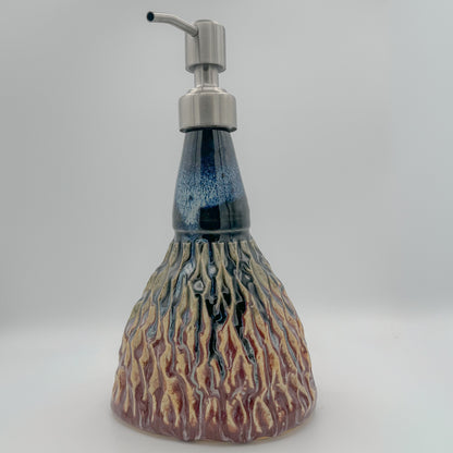 Ceramic soap dispenser with a unique design on a white background