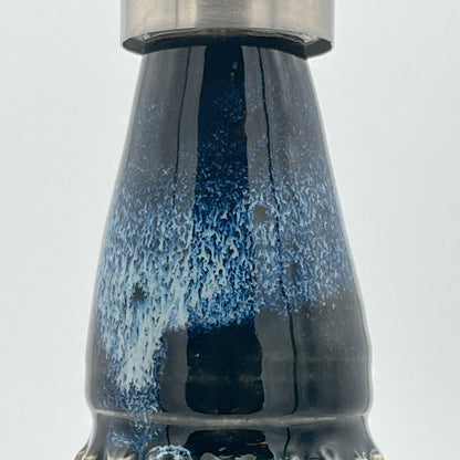 Detail with blue and white speckled pattern on a light gray background