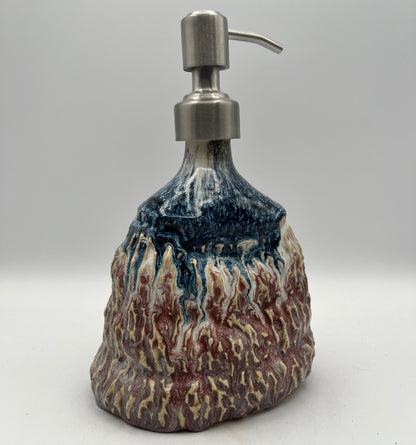 Soap dispenser with a natural stone design on a white background