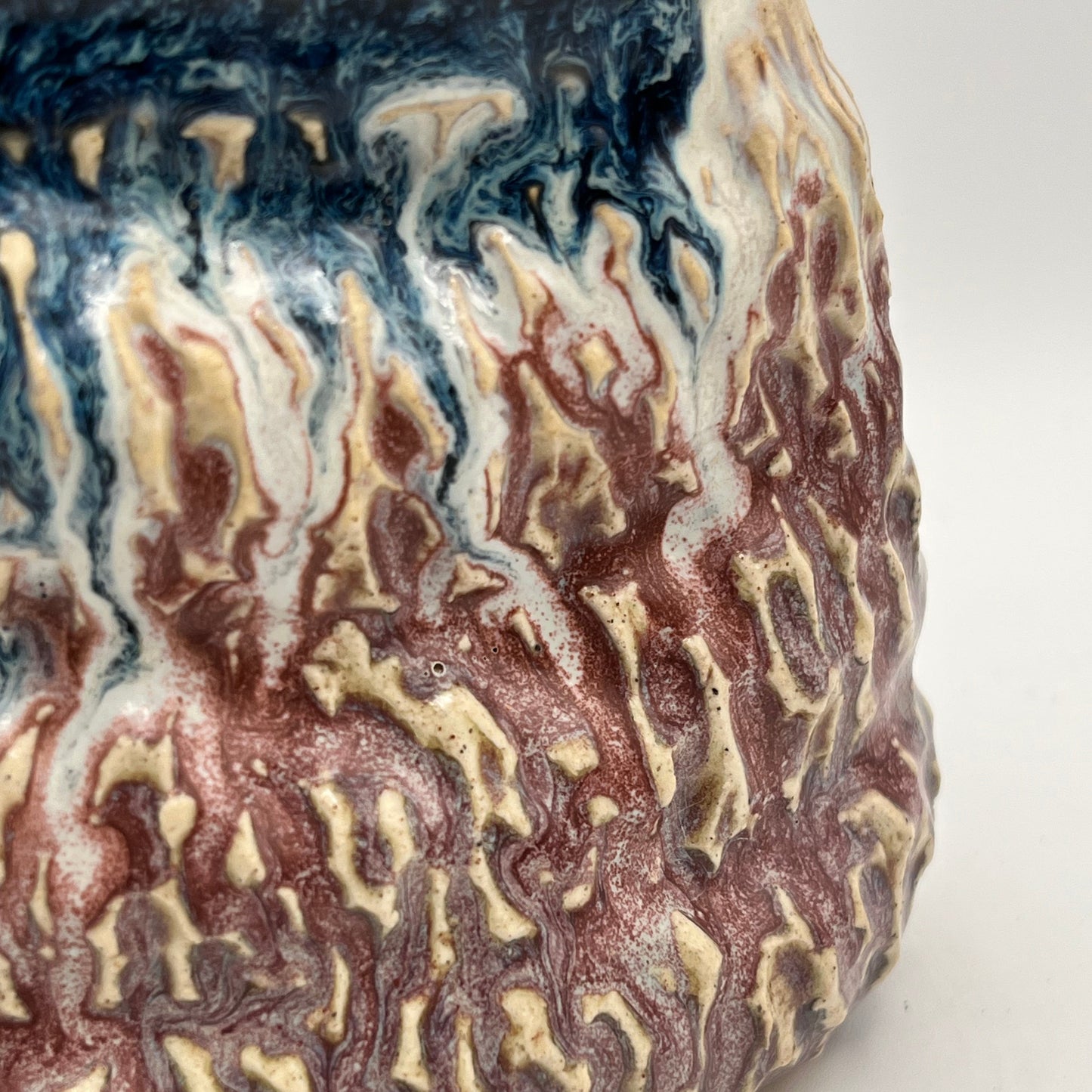 Marbled surface with brown, white, and blue colors on a white background