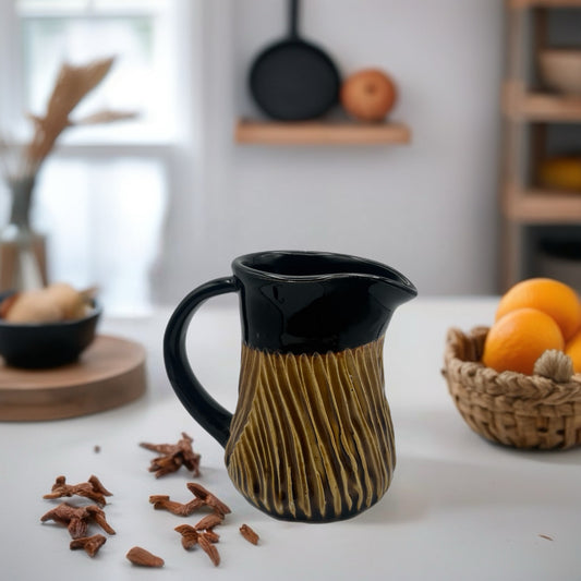 Black and Red Iron Creamer