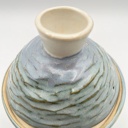 Handmade ceramic sugar bowl with blue and white glaze and textured lid